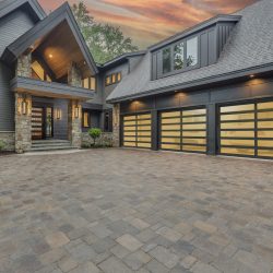 Wood garage door with stone columns